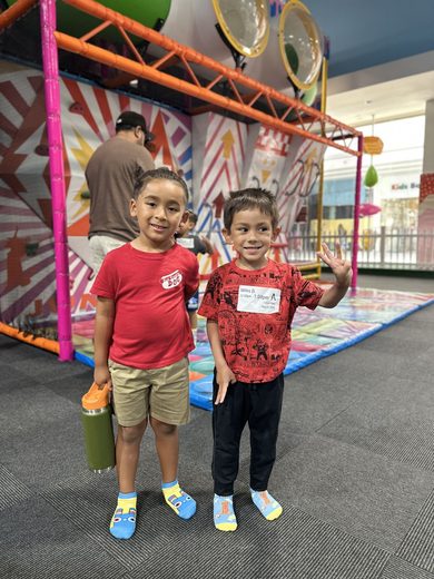 Roman with a friend at the play place